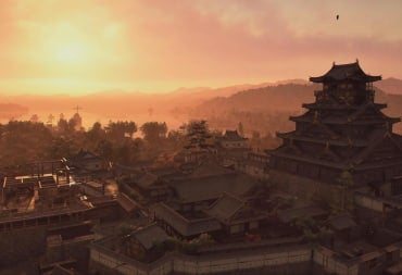 The sun sets over a castle in Assassin's Creed Shadows