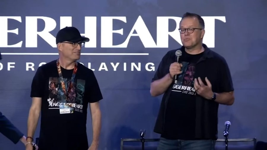A screenshot of Chris Perkins and Jeremy Crawford on stage with the Daggerheart banner behind them.