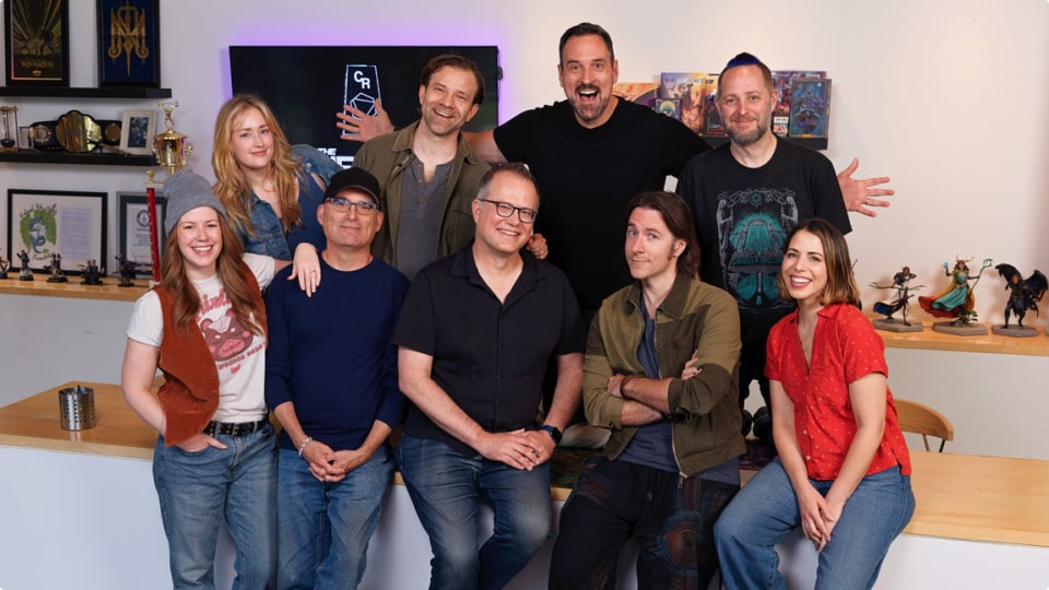 A group photo containing Matt Mercer, his team, Chris Perkins, and Jeremy Crawford.