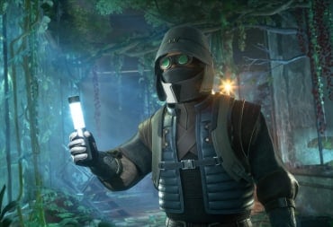 A masked character holding up a light in Funcom's Dune: Awakening