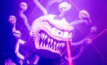 A photo of a ball-shaped one-eyed monster with multiple eye stalks.