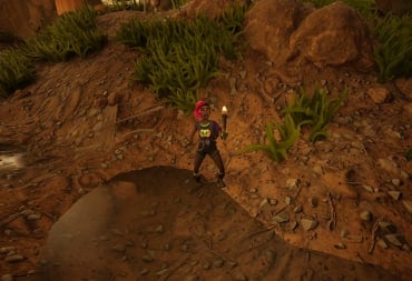 Willow holding a torch and spear near a puddle in Grounded 2