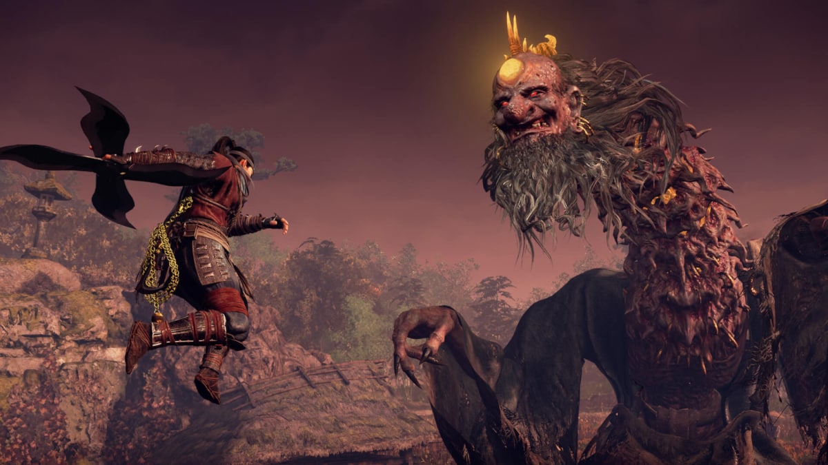 The player leaping to attack a monstrous-looking boss in Nioh 3