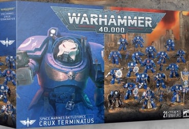 A game box featuring multiple blue-armored Space Marines holding shields and battle standards.