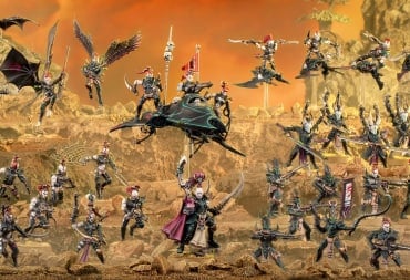 Three rows of drukhari miniatures on a layered sandy mound.