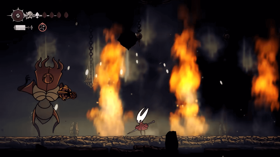 Hornet fighting The Last Judge with fire erupting around her.